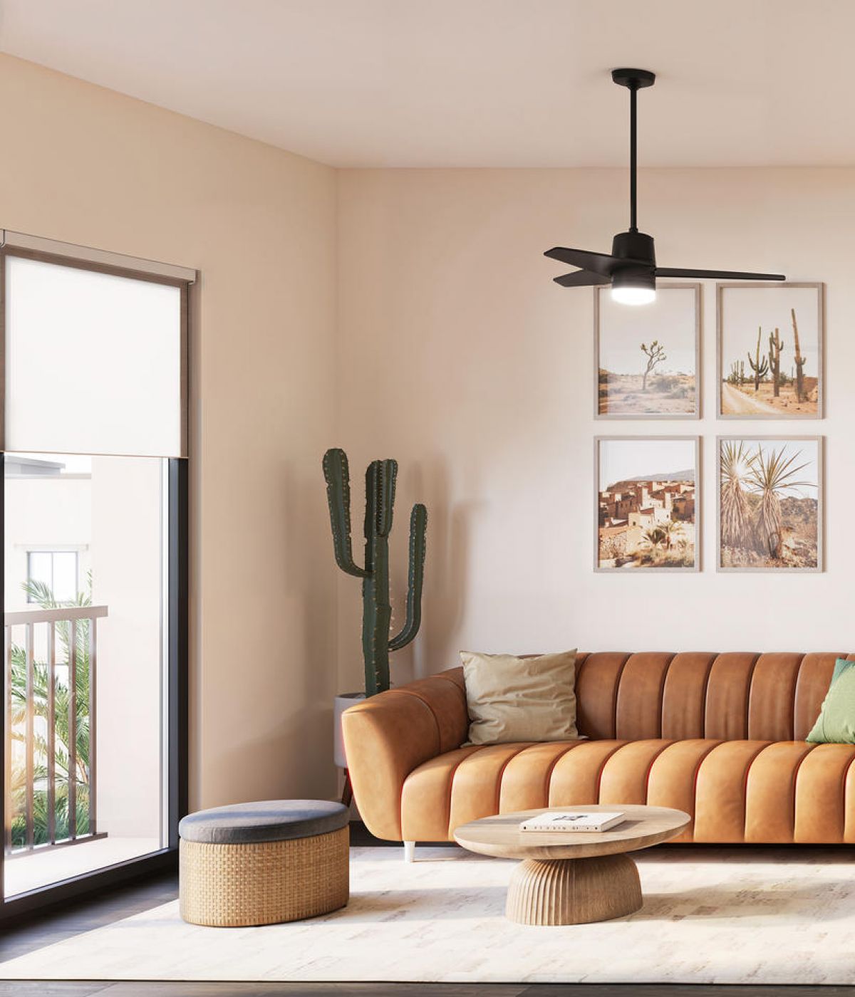 Modern living room with tan sofa, cactus plant, wall art, and dining table set near large window.